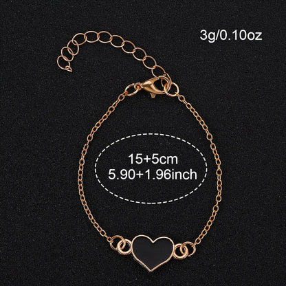 2pcs Women'S Elegant Black Round Quartz Watch with Golden-Tone Alloy Case & Heart Pendant Bracelet - Silicone Strap, Button Battery, Stylish Accessory for Casual Attire, Quartz Watch, Sophisticated Design, Durable Watch